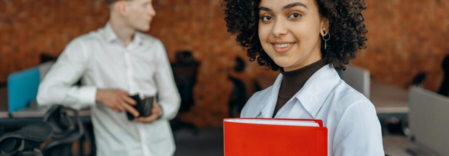 Young people holding papers and coffee, while waiting at the office for rosado accounting the best accountant in Puerto Rico